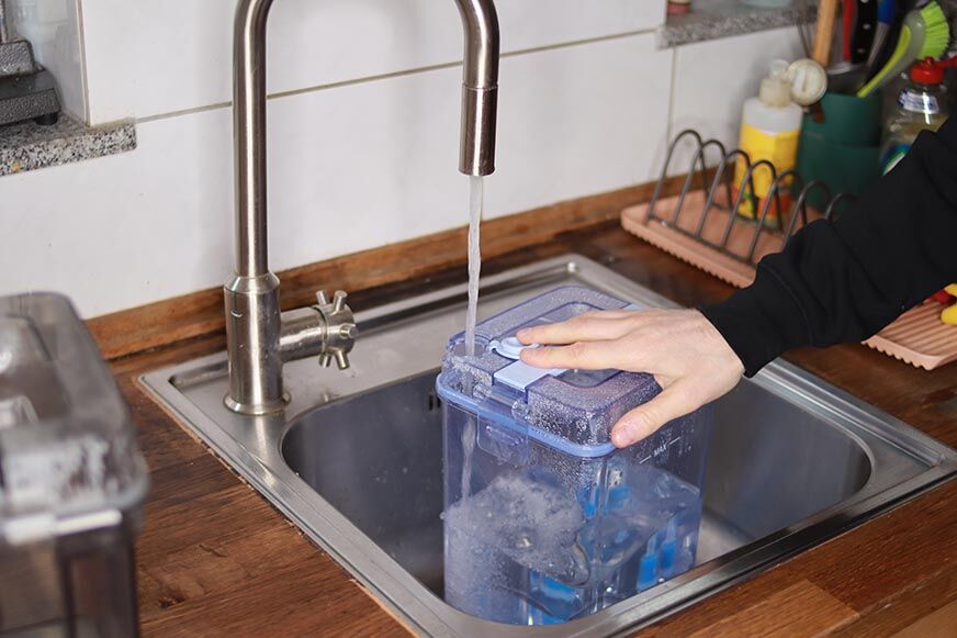 The entire package of the Ecovacs Deebot X1 OMNI is on the table.